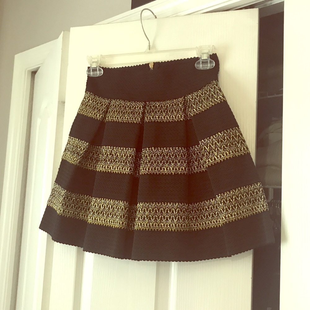 Brand new never worn mini skirt black and gold